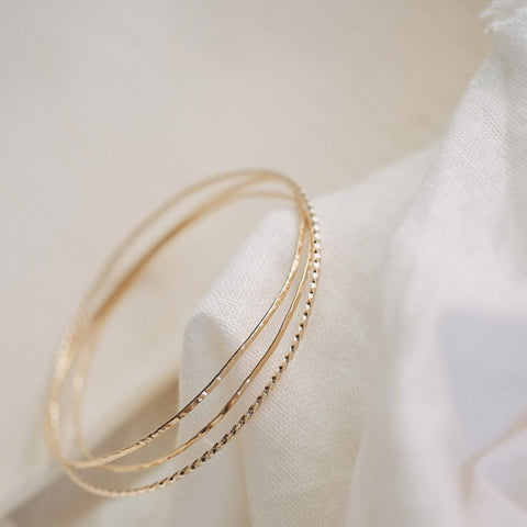 Set van drie armbanden 'draad van Ariadne' (massief goud)