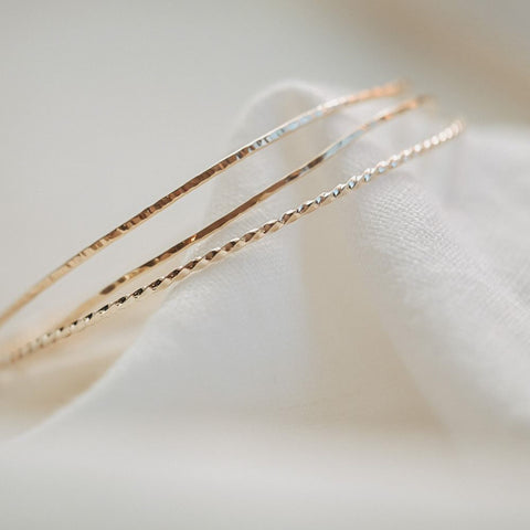 Set van drie armbanden 'draad van Ariadne' (massief goud)